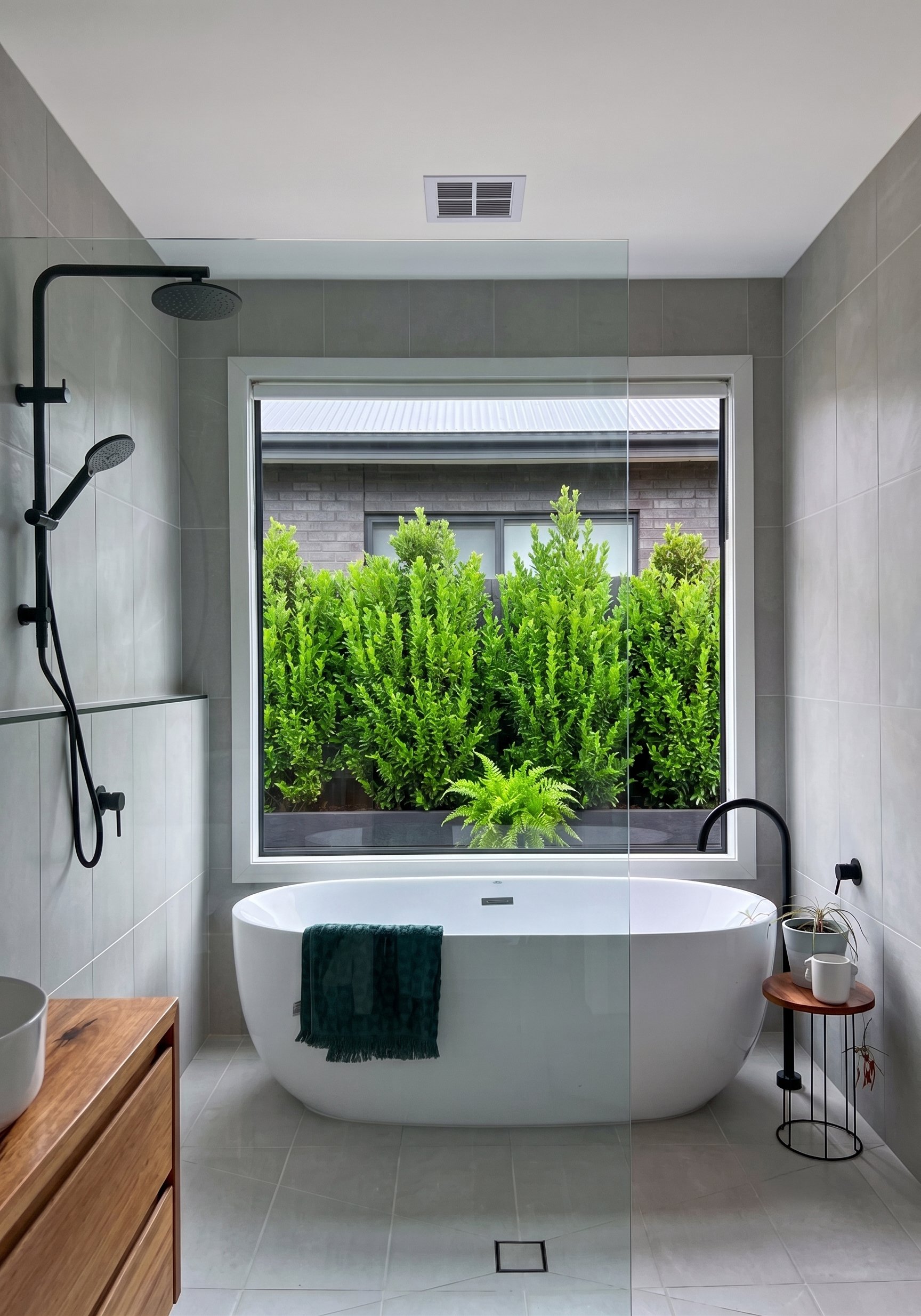 Freestanding Bath And Black Rain Shower Head In A Custom Home Builder Torquay Ensuite With Garden Outlook