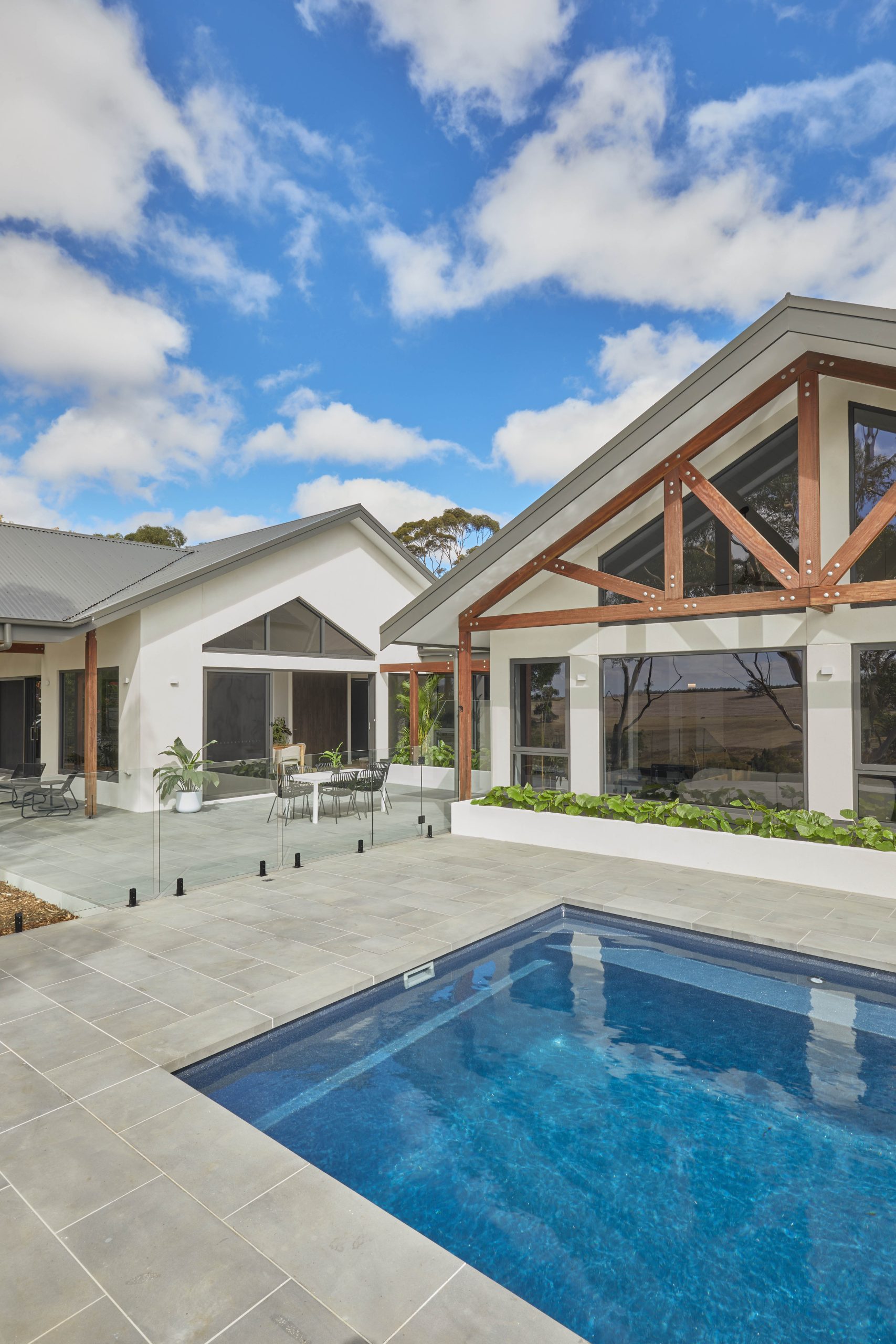 Home&Apos;S Rear Elevation With Pool Terrace And Covered Outdoor Dining Area