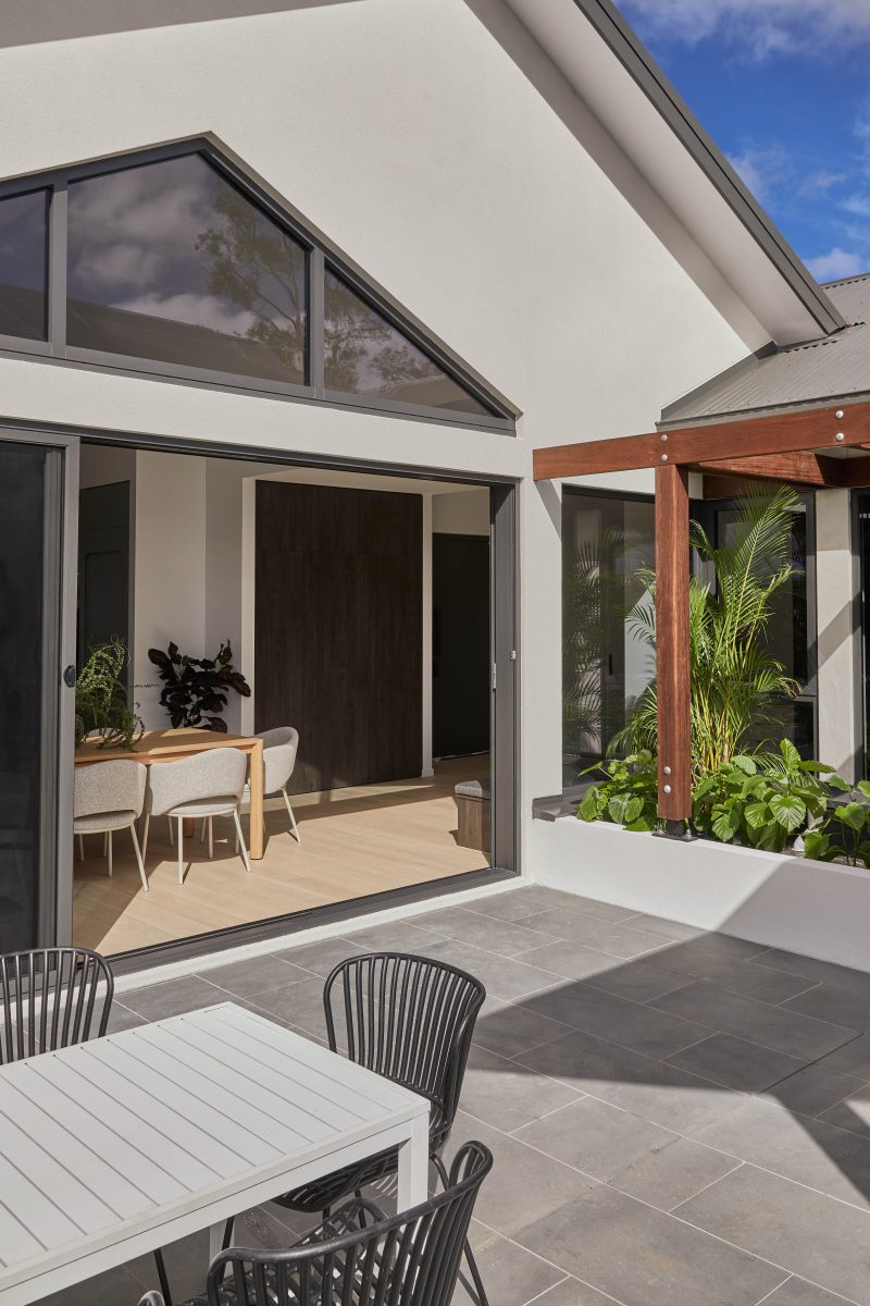 Courtyard Entry Framed By Timber Pergola And Native Garden Planting