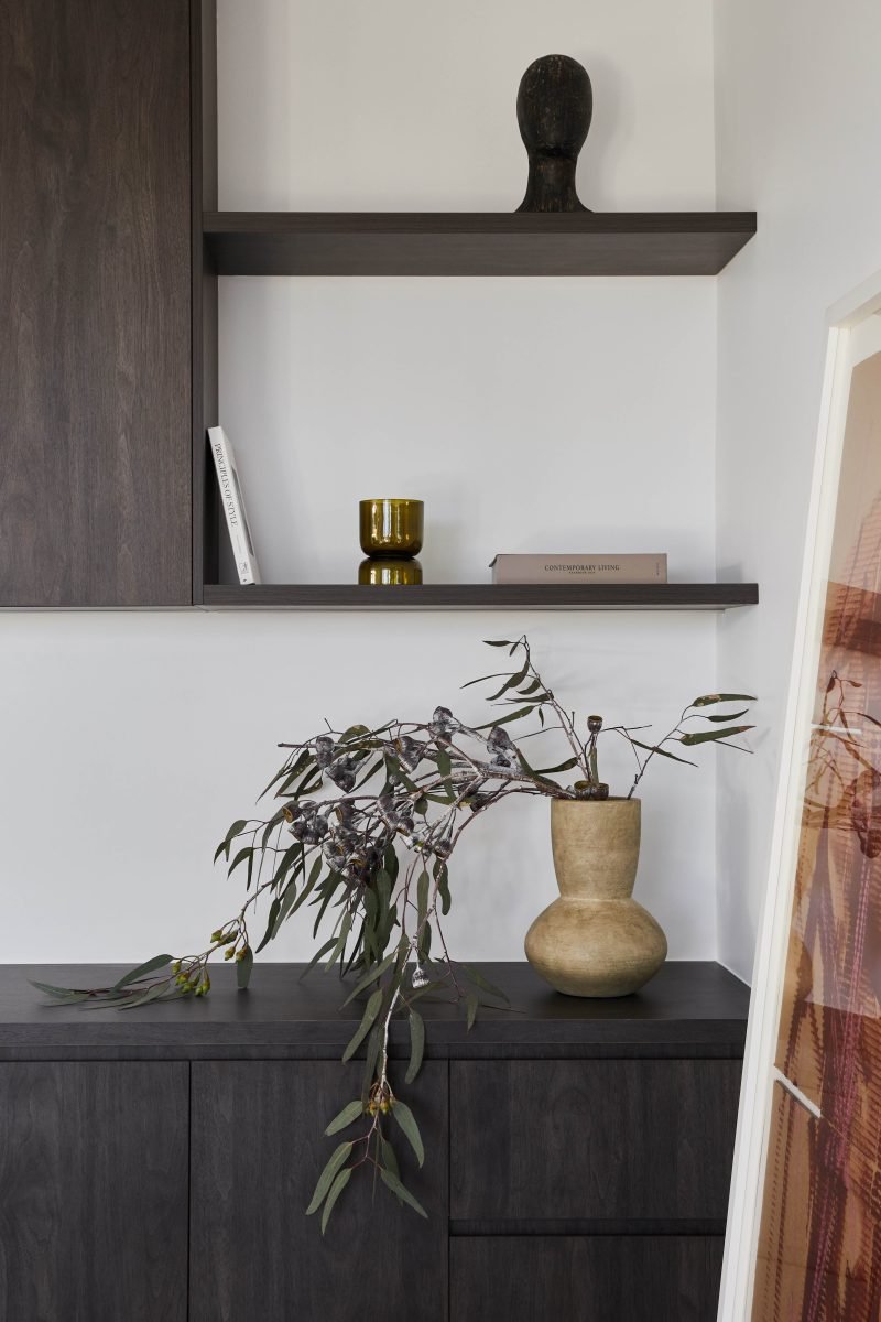 Dark Timber Credenza Styled With Ceramics And Native Foliage In The Home Office