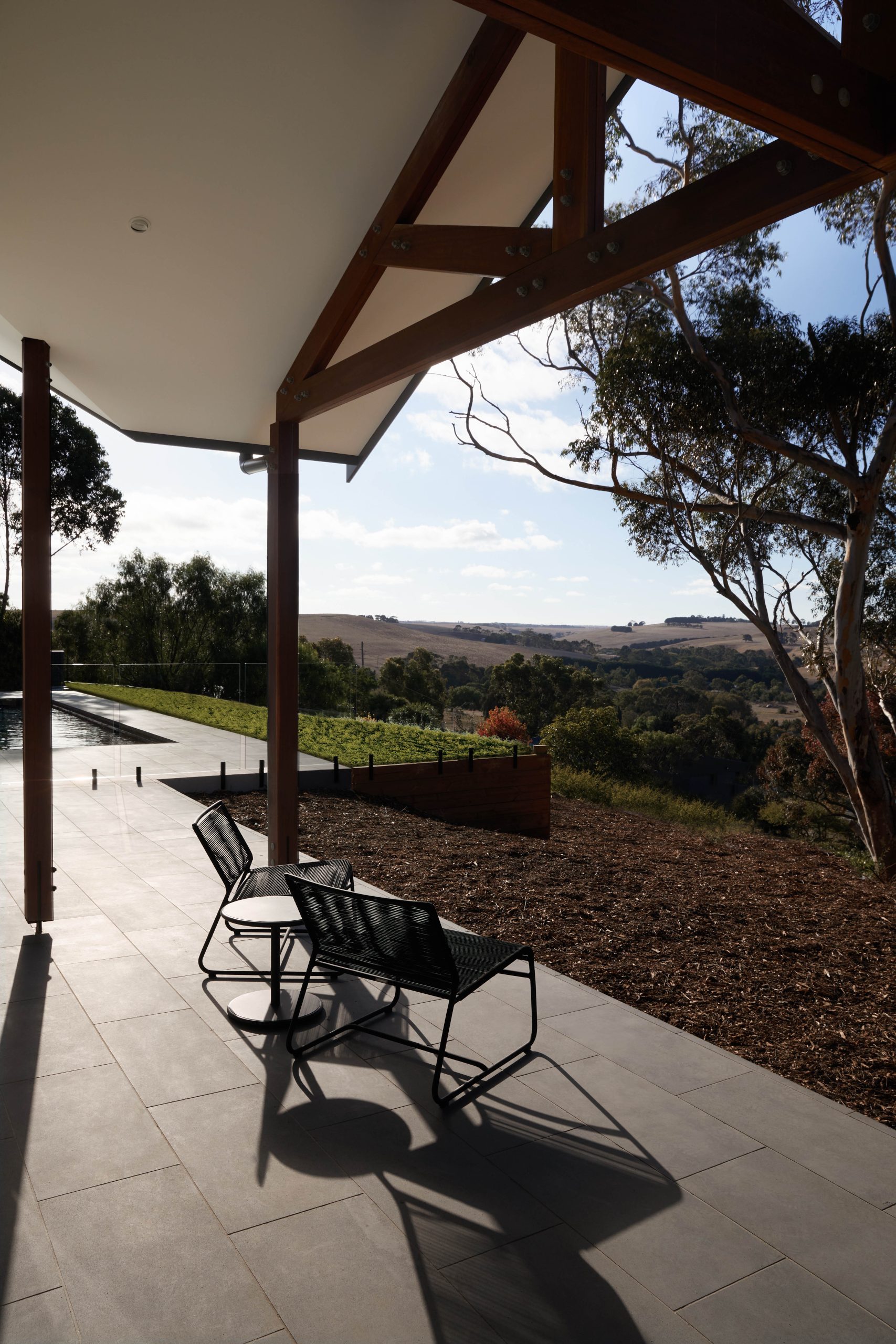 Outdoor Lounge Chairs On The Terrace Overlooking Waurn Ponds Hills