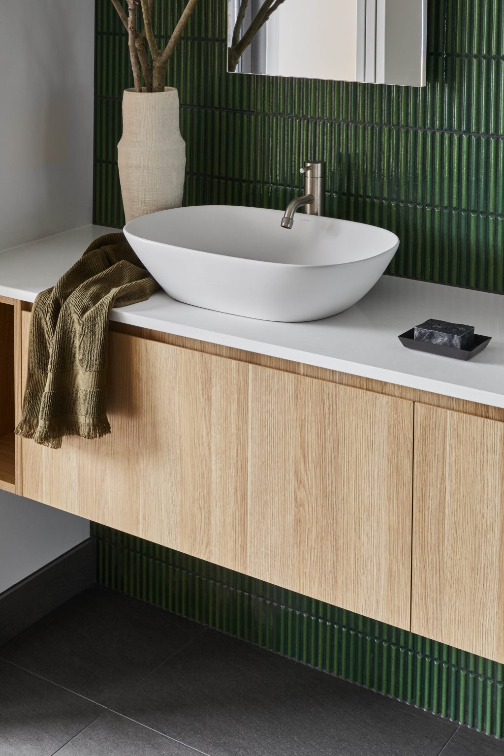 Ensuite Vanity Detail With Brushed Brass Tapware And A Ceramic Vase