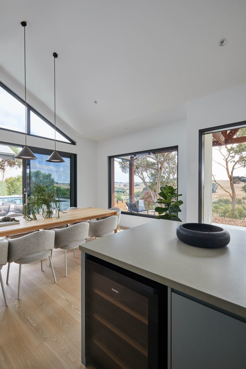 Black Leather Bar Stool At The Kitchen Island On European Oak Flooring