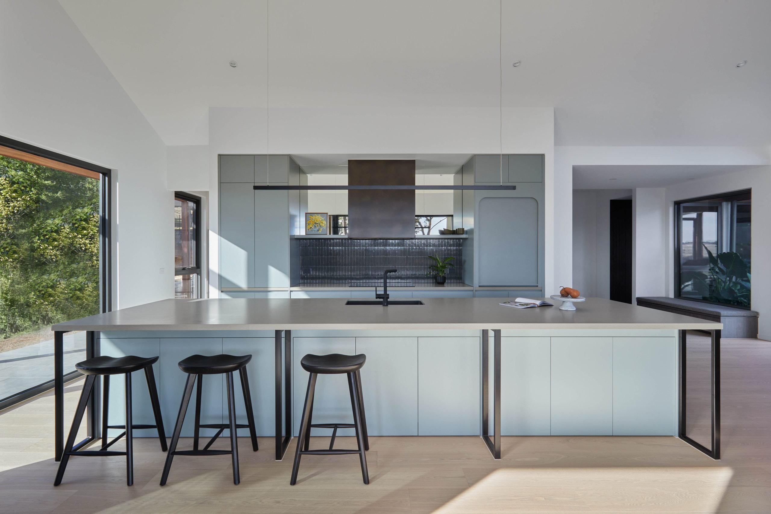 Fluted Dark-Tiled Splashback And Integrated Sink In The Reworked Kitchen