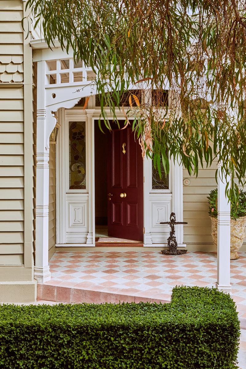 Restored Verandah At Tullynagee Featuring Byzantine Design Honed Tiles, Dulux Natural White Fretwork, And Heritage Timber Bench.