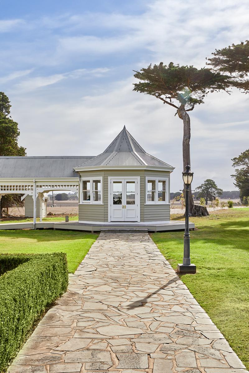 Restored Hexagonal Heritage Gazebo At Tullynagee Homestead In Warrnambool, Connected By Covered Walkway With Slate Paving.