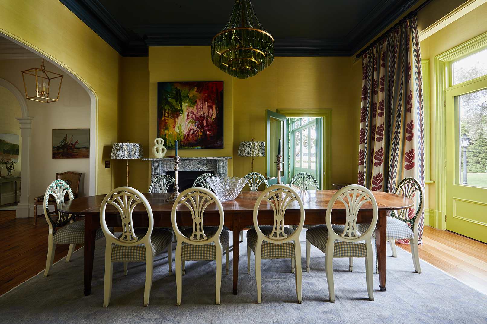 Tullynagee Formal Dining Room Featuring Radiant Yellow Walls, A Dark Contrasting Ceiling, And Restored Baltic Pine Floors.