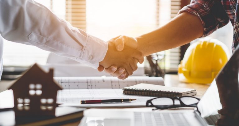 Handshake between a builder and property developer, representing the Victorian developer bond scheme 2026 partnership