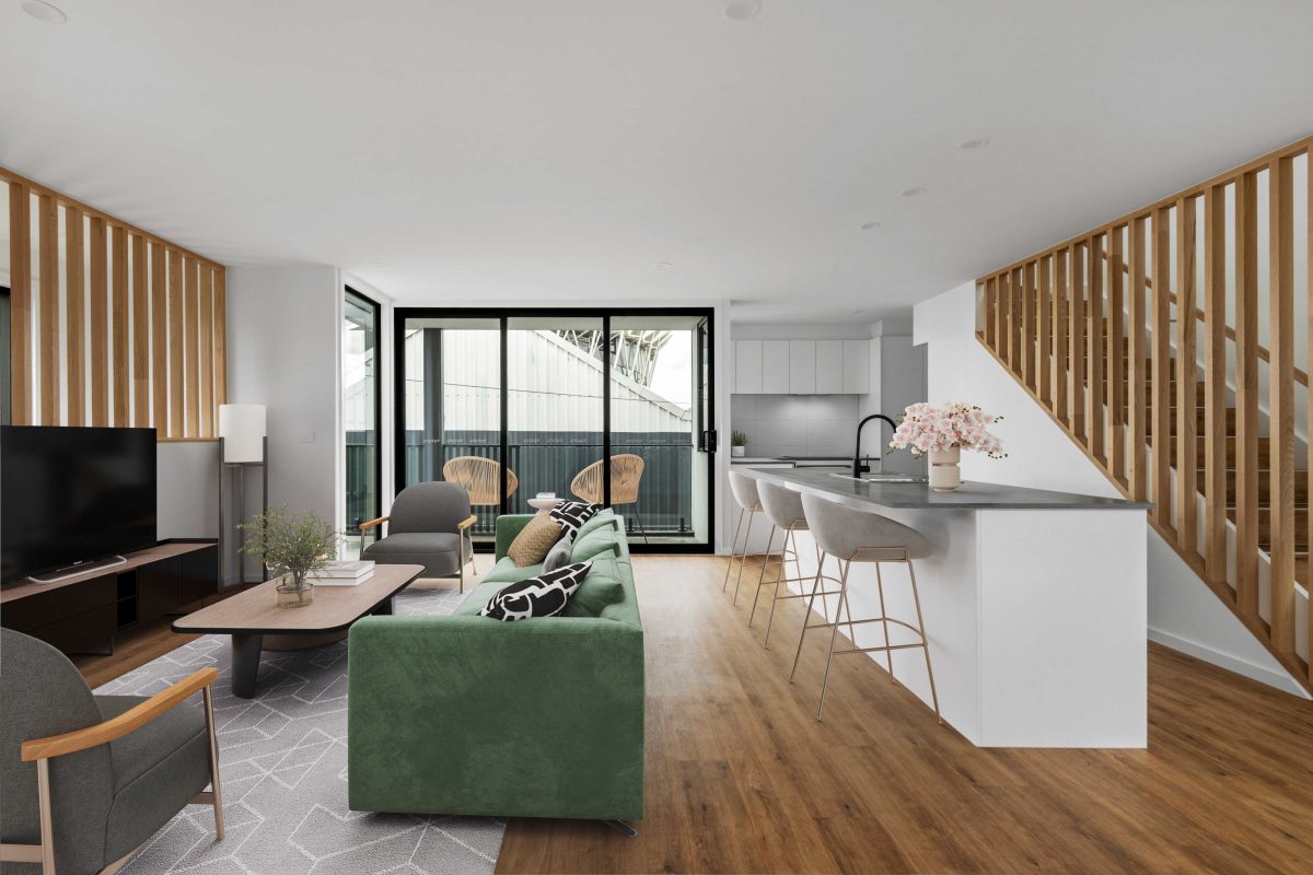 Townhouse Development South Geelong – Open-Plan Living Area With Green Sofa And Timber Flooring