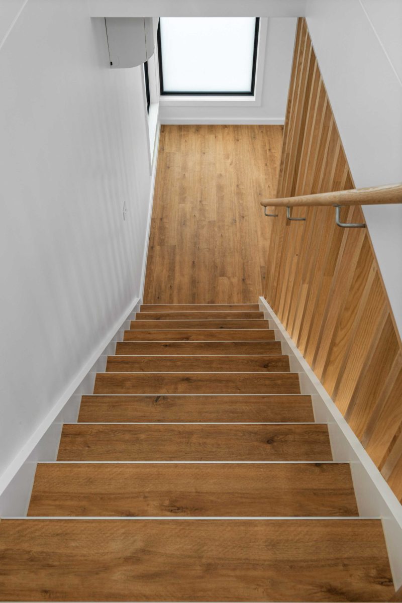 Townhouse Development South Geelong – Close View Of Timber Staircase Treads And Wall-Mounted Steel Handrail