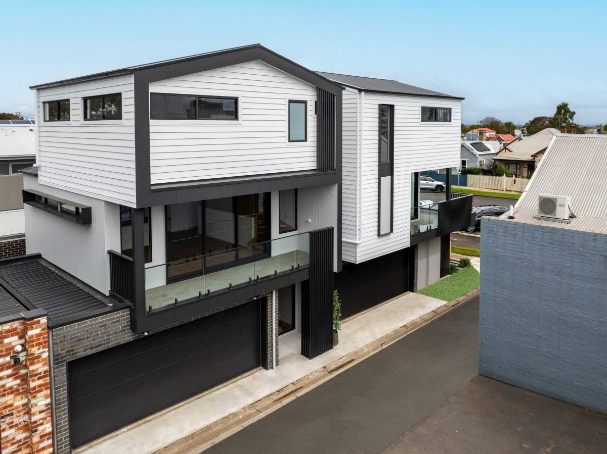 Townhouse Development South Geelong – Ground-Level View Of Garage Doors, Brick Pillar And Concrete Driveway