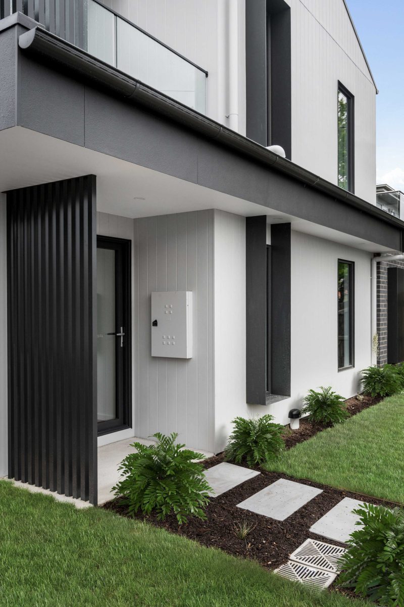 Townhouse Development South Geelong – Front Entry With Glass Balustrade Balcony Above And Precast Concrete Panel Wall