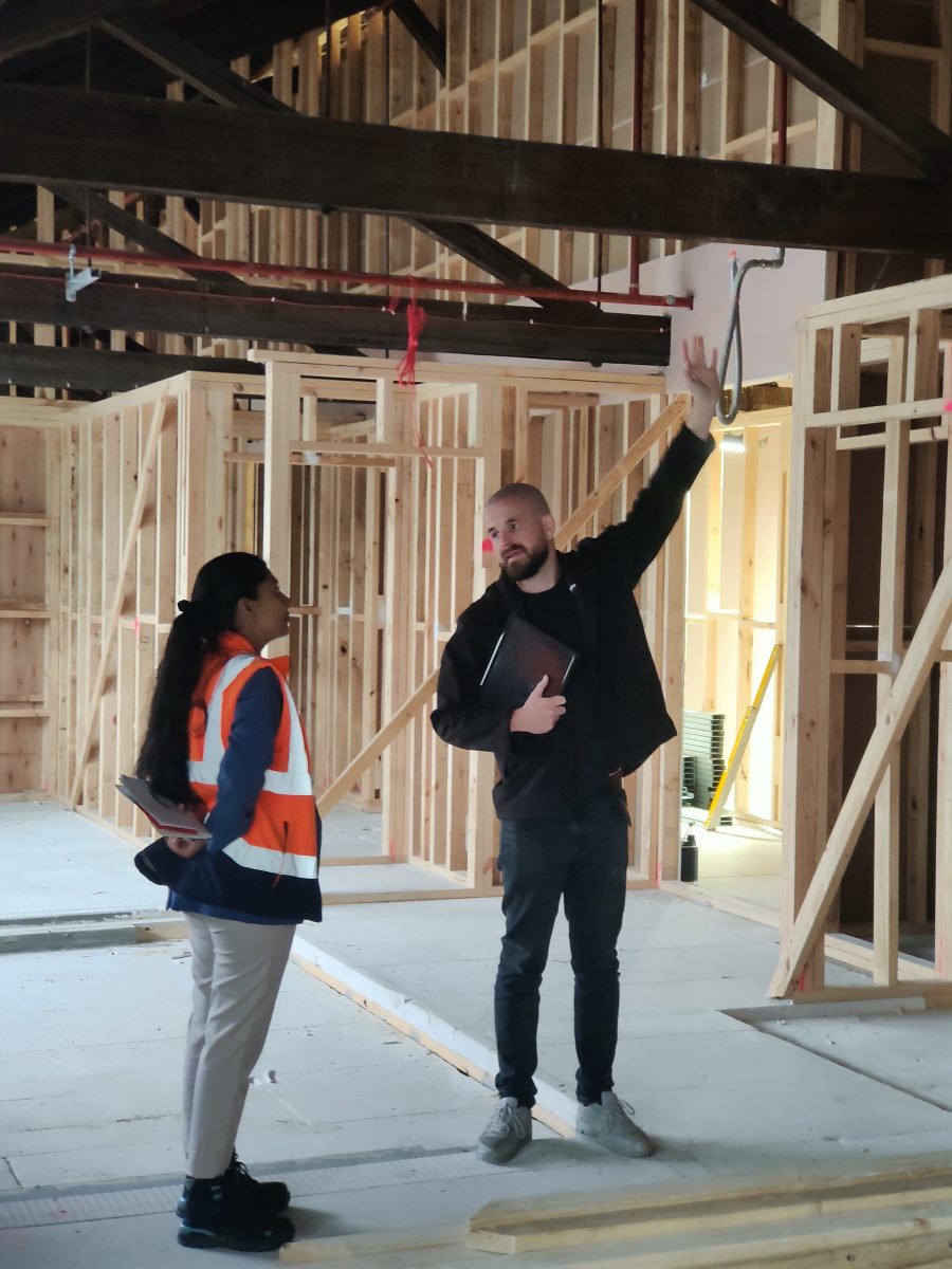 Fox Building Group Managing Director Jesse Harris Discussing Structural Compliance With An Iso Auditor On-Site At The Geelong Bottleworks Apartments Heritage Conversion.
