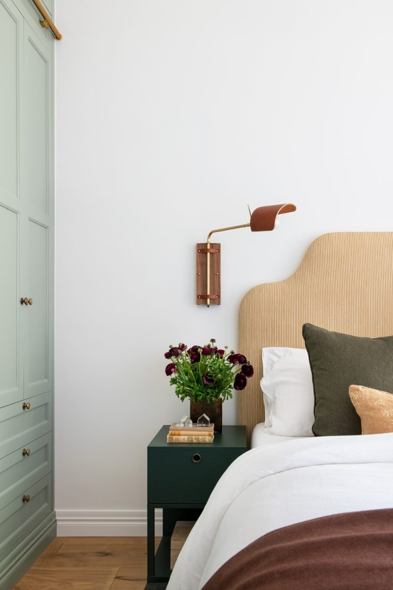 Bedside Styling With A Leather-Shade Reading Light And Corduroy Headboard In A Bedroom Of The Award-Winning Carlton Renovation By Fox Building Group.