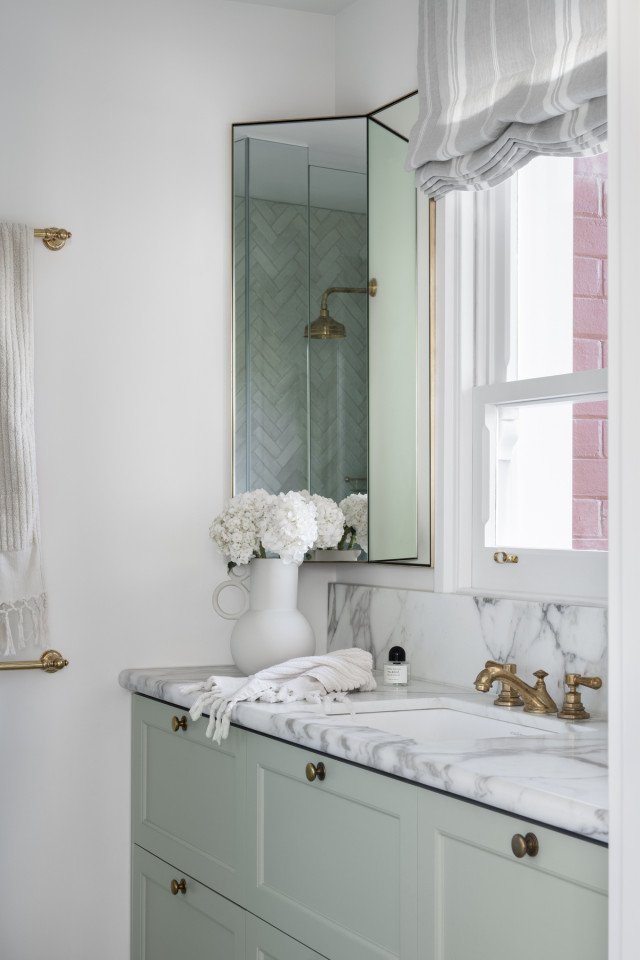 Sage Green Vanity With Marble Benchtop And Brass Tapware In A Bathroom Of The Award-Winning Carlton Renovation By Fox Building Group.