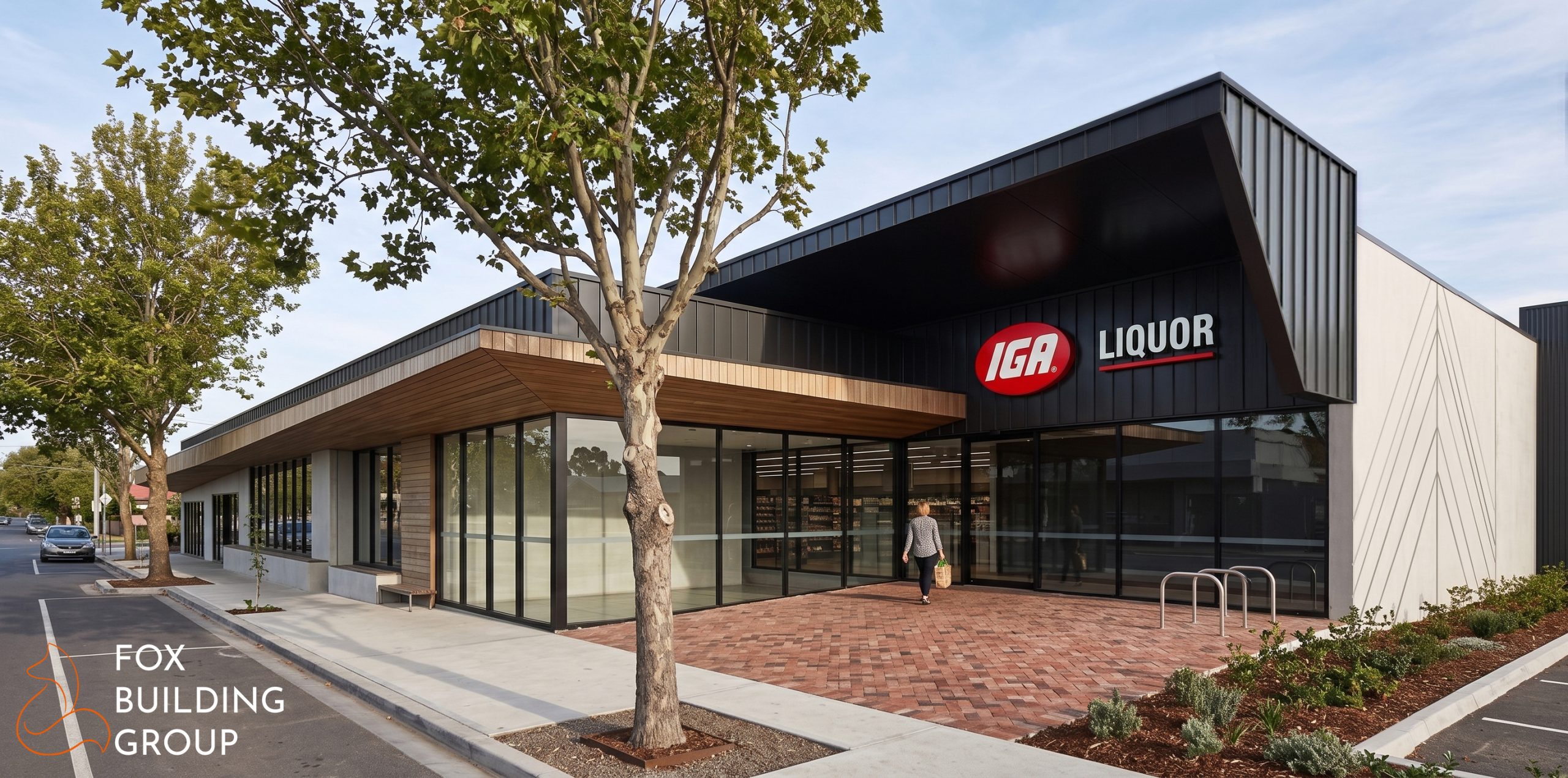 Architectural Render Of Iga Supermarket And Liquor Store, Winchelsea, Victoria, Showing Charcoal Metal Cladding, Timber Battens And Black Shopfront Glazing